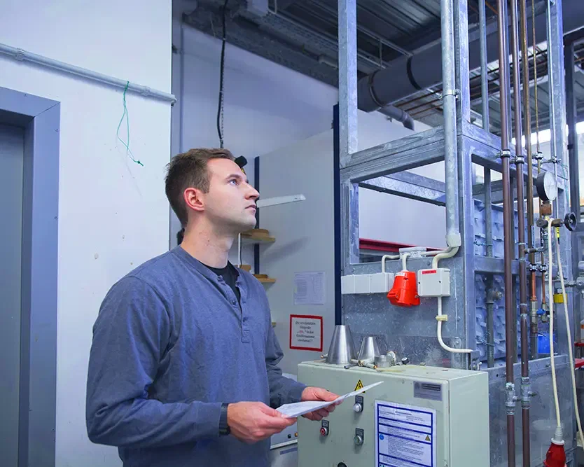 Technician inspecting a heating system