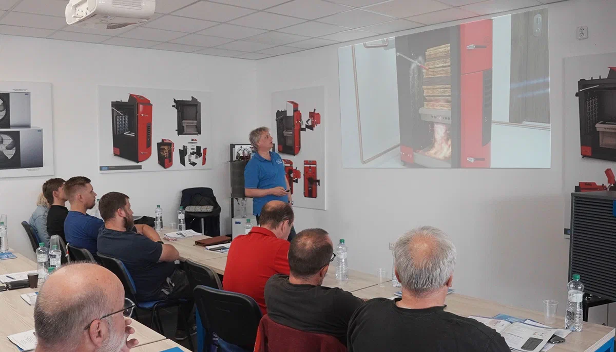 ATTACK service partners at professional training beside heating products