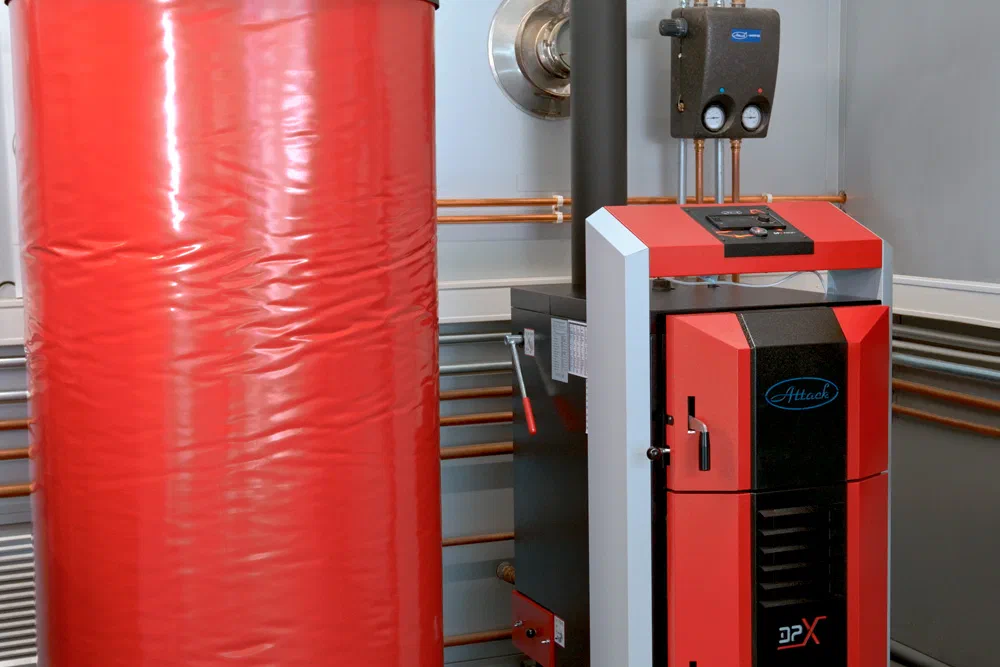 ATTACK DPX wood boiler connected to a chimney