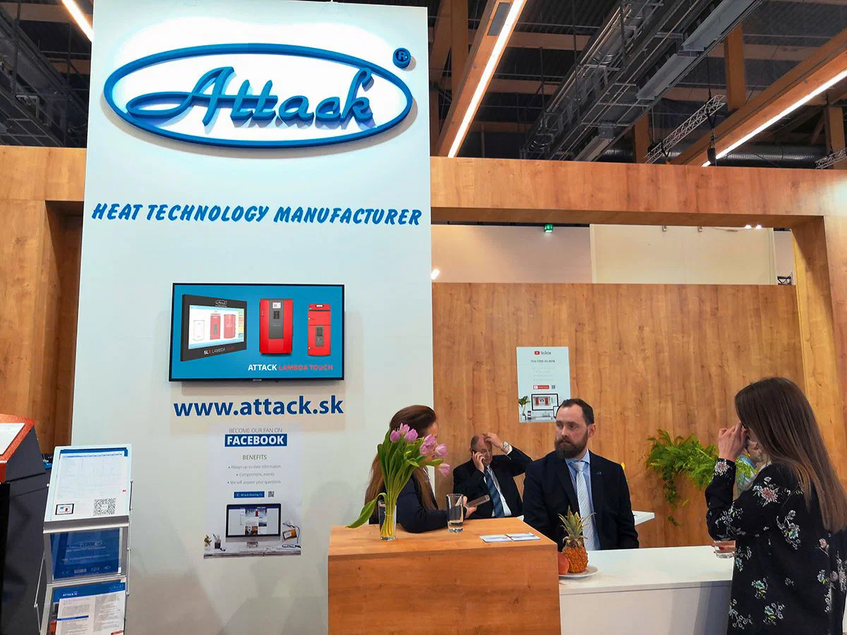 Business partners meeting at the ATTACK exhibition stand