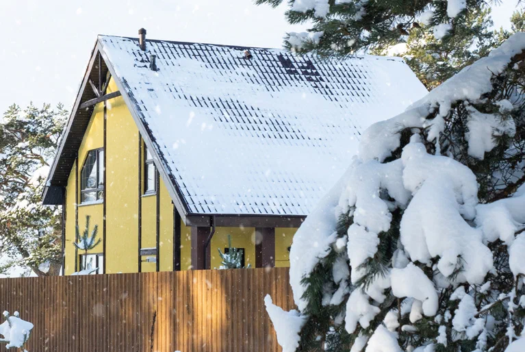 Family home covered in snow in winter